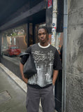 DAXUEN Oversized short-sleeved graphic T-shirt in black or white — model photo