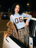 DAXUEN light blue long-sleeve t-shirt with blocky '06' graphic — model photo