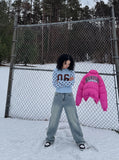 DAXUEN light blue long-sleeve t-shirt with blocky '06' graphic — model photo