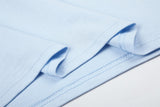 DAXUEN light blue long-sleeve t-shirt with blocky '06' graphic