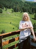 DAXUEN Oversized Bold Lettering Graphic Tee — model photo