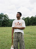 DAXUEN Oversized Bold Lettering Graphic Tee — model photo