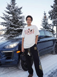 DAXUEN Oversized Bold Lettering Graphic Tee — model photo