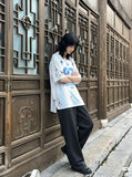 DAXUEN white and light blue striped oversized jersey tee with graphic — model photo