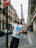 DAXUEN white and light blue striped oversized jersey tee with graphic — model photo
