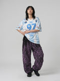 DAXUEN white and light blue striped oversized jersey tee with graphic — model photo