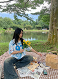 DAXUEN white and light blue striped oversized jersey tee with graphic — model photo