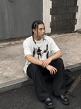 DAXUEN dark purple oversized blurred-figures graphic tee — model photo