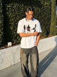DAXUEN dark purple oversized blurred-figures graphic tee — model photo