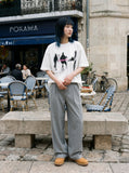 DAXUEN dark purple oversized blurred-figures graphic tee — model photo