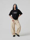 DAXUEN black oversized blurred-line graphic t-shirt — model photo
