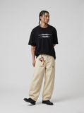 DAXUEN black oversized blurred-line graphic t-shirt — model photo