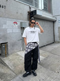 DAXUEN black oversized blurred-line graphic t-shirt — model photo