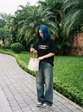 DAXUEN black oversized blurred-line graphic t-shirt — model photo