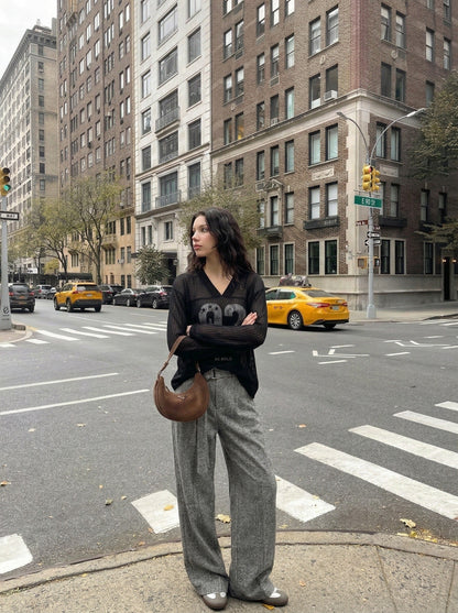 DAXUEN Long-sleeved V-neck top with graphic prints — model photo