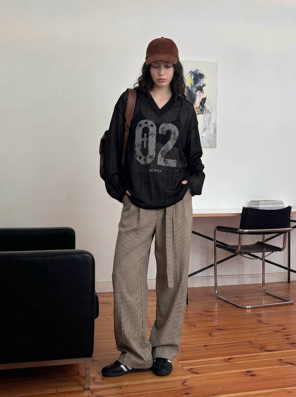 DAXUEN Long-sleeved V-neck top with graphic prints — model photo