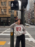 DAXUEN grey and black long-sleeve top with flame graphic — model photo