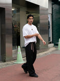 DAXUEN black oversized abstract three-part graphic tee — model photo