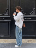 DAXUEN dark blue bold back graphic long-sleeved crew top — model photo