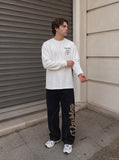 DAXUEN dark blue bold back graphic long-sleeved crew top — model photo