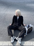 DAXUEN black wide-leg cargo trousers with pockets — model photo