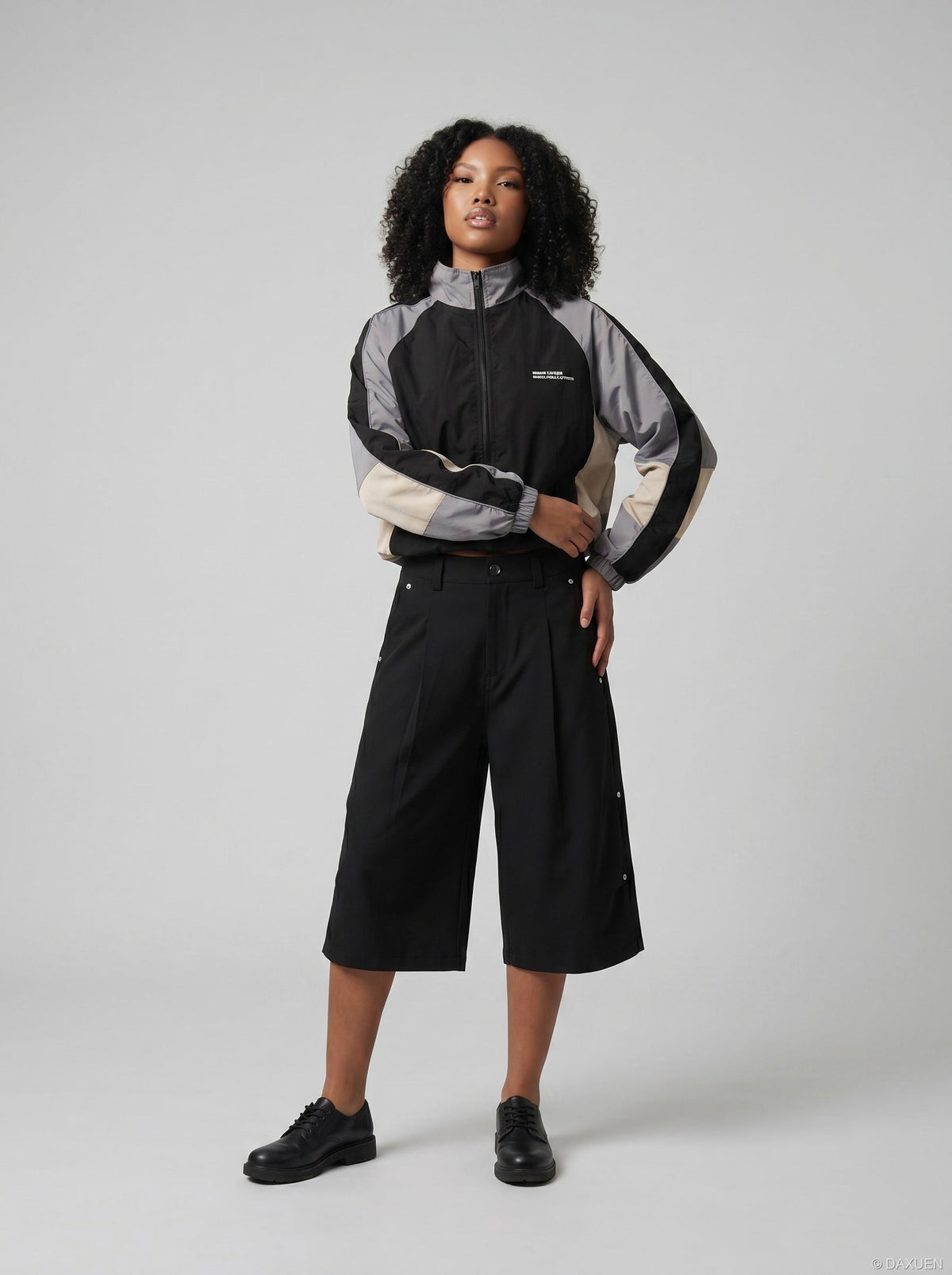 DAXUEN Black wide-leg cropped trousers with pleats and studs — model photo