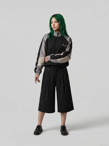 DAXUEN Black wide-leg cropped trousers with pleats and studs — model photo