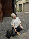 DAXUEN white oversized bold block lettering graphic tee — model photo