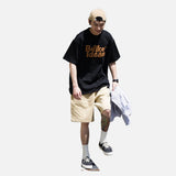 DAXUEN black oversized bold brown-orange wordmark graphic t-shirt