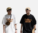 DAXUEN black oversized bold brown-orange wordmark graphic t-shirt