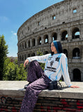 DAXUEN white long-sleeve jersey with bold brushstroke graphics — model photo