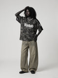DAXUEN dark camouflage oversized jersey top — model photo