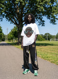 DAXUEN Oversized short-sleeve T-shirt with cartoon character graphic — model photo