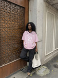 DAXUEN pink oversized cartoon graphic jersey tee — model photo