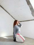 DAXUEN Wide-leg pants with red cross graphic and adjustable drawstrings — model photo
