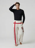 DAXUEN Wide-leg pants with red cross graphic and adjustable drawstrings — model photo
