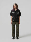 DAXUEN Bold Cuban collar button-up shirt with cross graphics — model photo