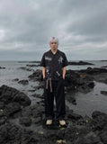 DAXUEN Bold Cuban collar button-up shirt with cross graphics — model photo