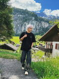 DAXUEN black oversized bold-emblem back print tee — model photo