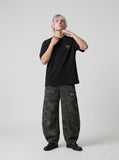 DAXUEN black oversized bold-emblem back print tee — model photo