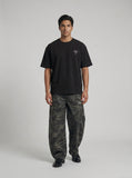 DAXUEN black oversized bold-emblem back print tee — model photo