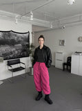 DAXUEN black wide-leg trousers with bold emblem — model photo