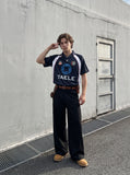 DAXUEN white and navy blue bold geometric graphic football jersey — model photo