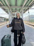 DAXUEN charcoal grey zip jacket with gold text — model photo