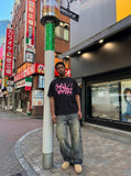 DAXUEN Bold graffiti text short-sleeve T-shirt in black and white — model photo