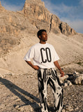 DAXUEN black oversized bold-graphic 33 t-shirt — model photo