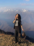 DAXUEN black oversized bold-graphic 33 t-shirt — model photo