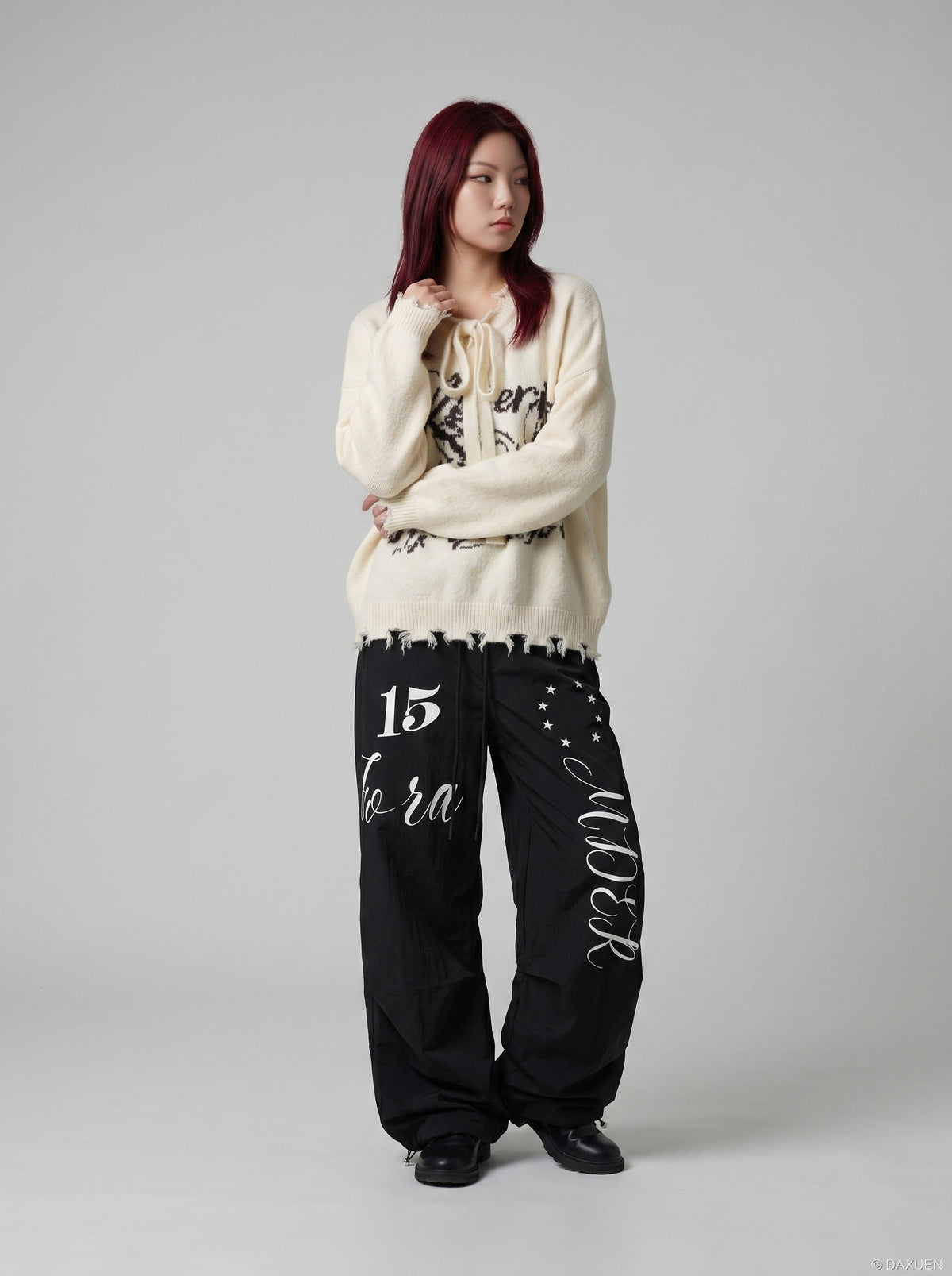 DAXUEN Oversized wide-leg track pants with graphic prints — model photo
