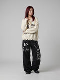 DAXUEN Oversized wide-leg track pants with graphic prints — model photo