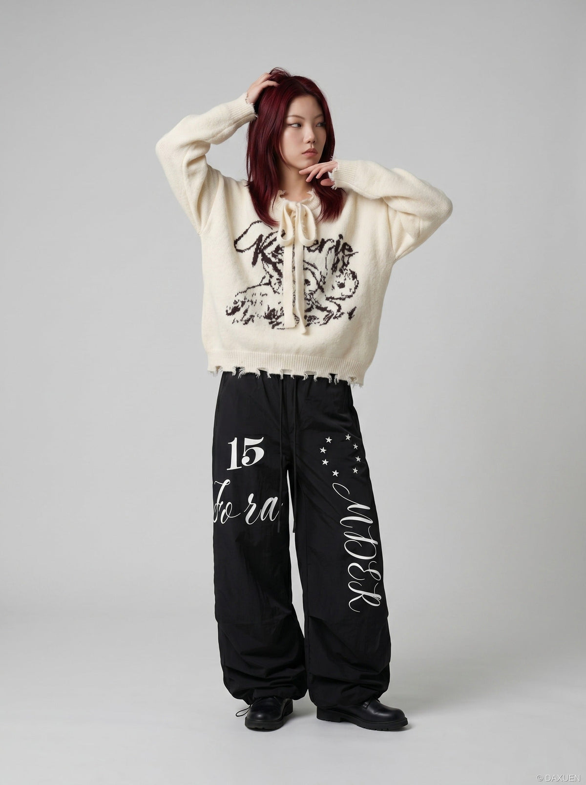 DAXUEN Oversized wide-leg track pants with graphic prints — model photo